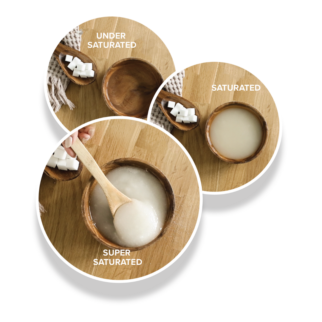 different sugar and water solutions in bowls with wooden spoons next to them